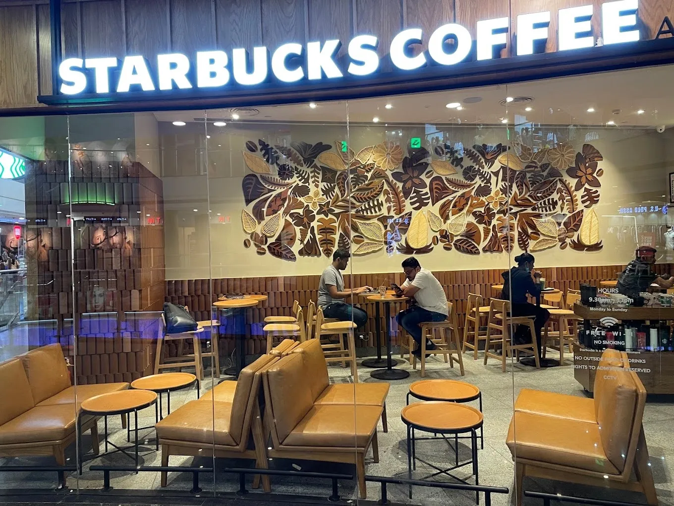Storefront view of the coffee-botanical installation at Starbucks HiLITE Mall, Kozhikode